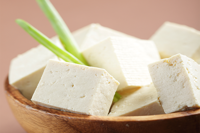 Image of tofu in a wooden bowl